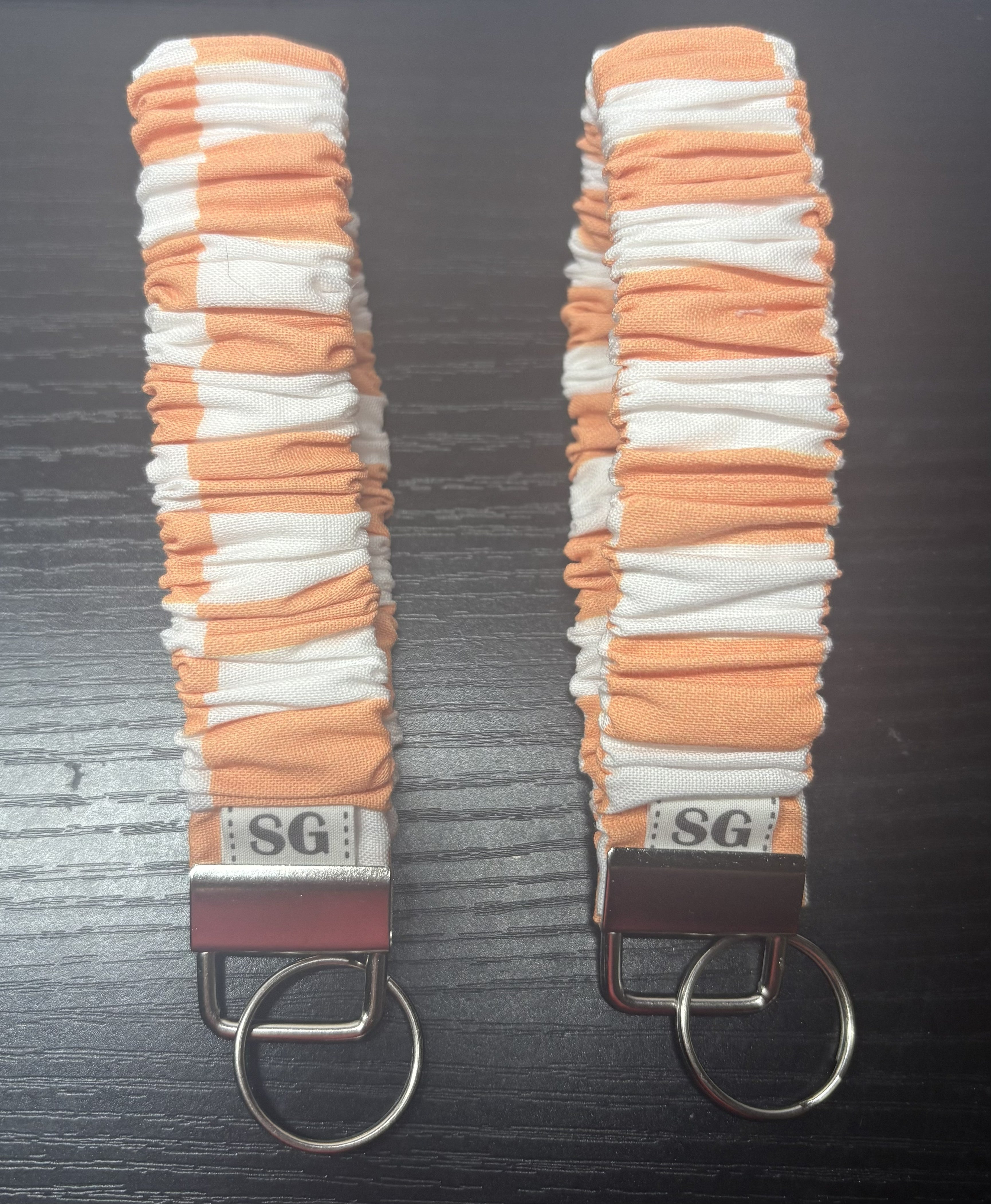 Orange and white checkered scrunchie wristlet