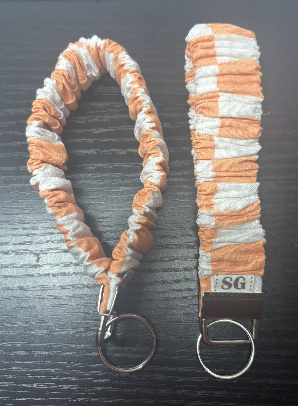 Orange and white checkered scrunchie wristlet
