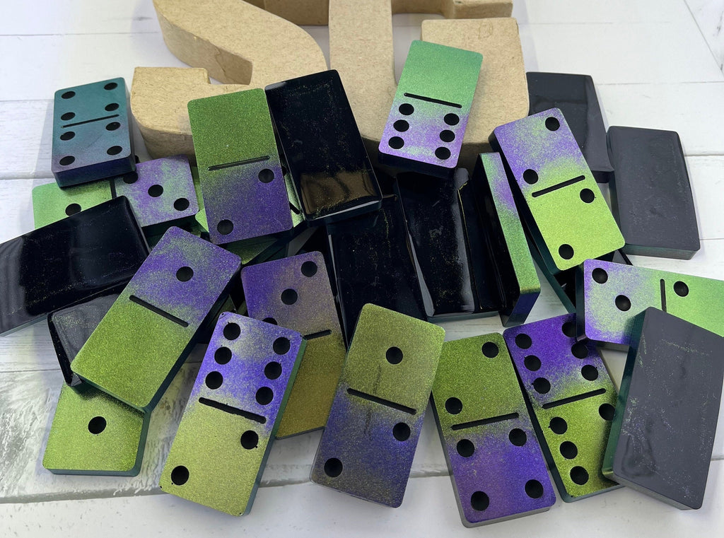Black, purple, and green handmade resin Dominoes.