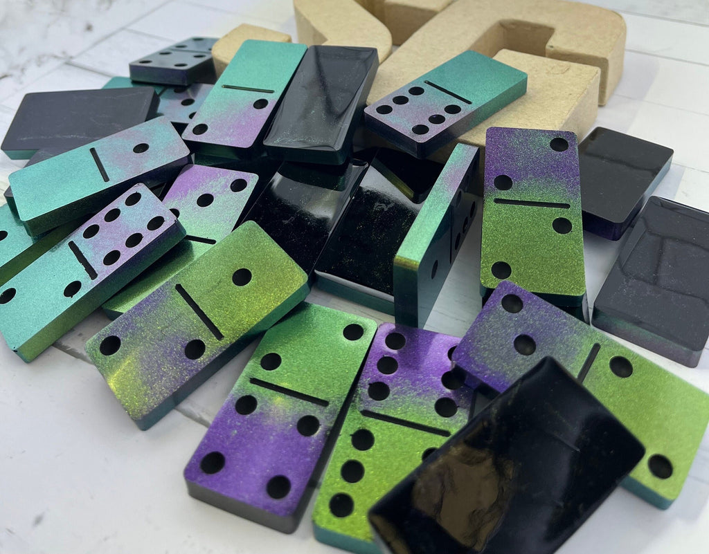 Black, purple, and green handmade resin Dominoes.